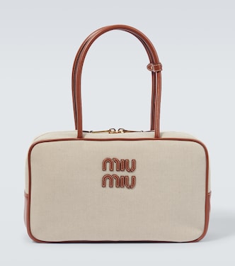 Logo leather-trimmed canvas tote bag | Miu Miu